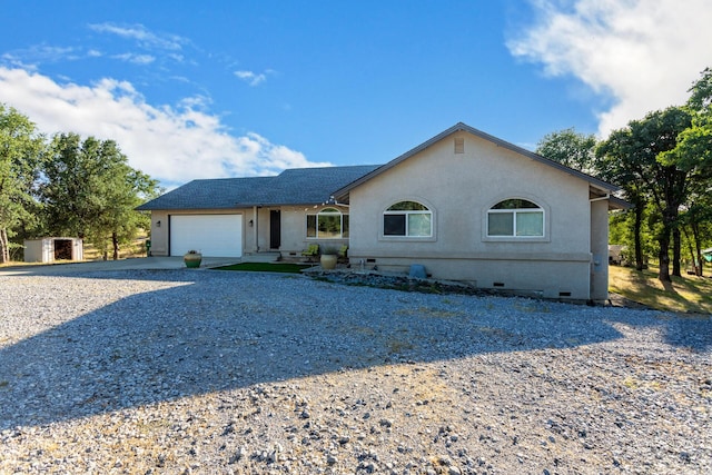 10844 Green Oaks Ln, Redding, CA 96003 - view of front of house featuring gravel driveway, crawl space, an attached garage, and stucco siding
