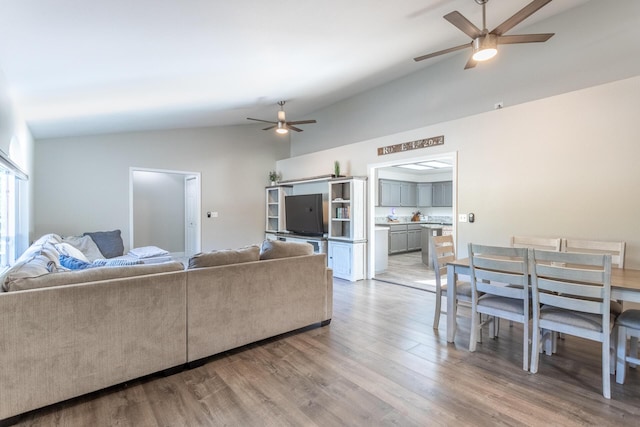 10844 Green Oaks Ln, Redding, CA 96003 - living room with vaulted ceiling, ceiling fan, and light wood finished floors