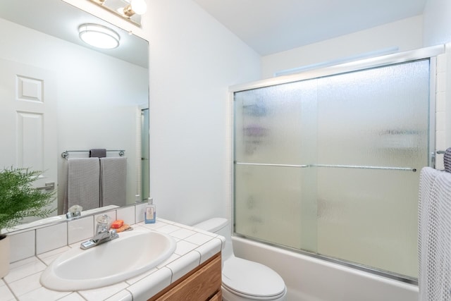 10844 Green Oaks Ln, Redding, CA 96003 - bathroom featuring toilet, combined bath / shower with glass door, and vanity