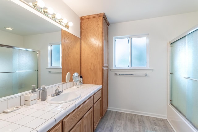 10844 Green Oaks Ln, Redding, CA 96003 - full bathroom with wood finished floors, vanity, and shower / bath combination with glass door