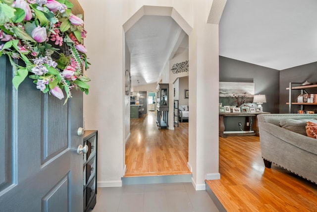 1163 Golden Gate Trl, Redding, CA 96003 - foyer with vaulted ceiling, wood finished floors, arched walkways, and baseboards