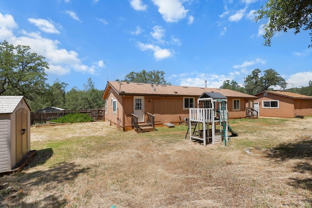 13955 Dusty Oaks Trl, Bella Vista, CA 96008 - back of property featuring a playground and entry steps