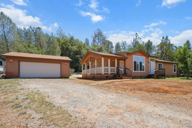 13955 Dusty Oaks Trl, Bella Vista, CA 96008 - view of front facade featuring crawl space, an outdoor structure, and a detached garage