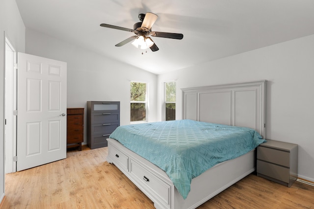 13955 Dusty Oaks Trl, Bella Vista, CA 96008 - bedroom featuring lofted ceiling, light wood-style flooring, and ceiling fan