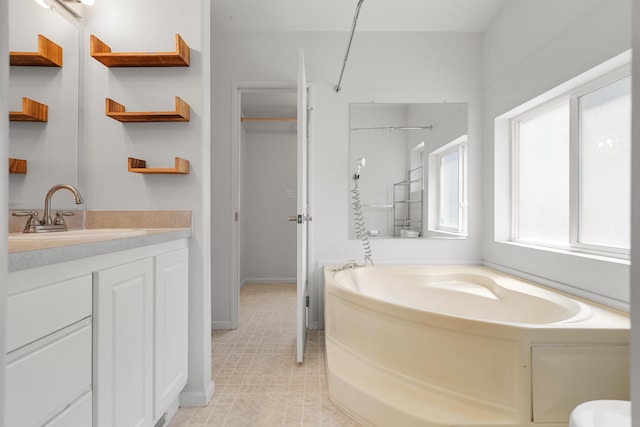 13955 Dusty Oaks Trl, Bella Vista, CA 96008 - bathroom with a garden tub, vanity, and baseboards