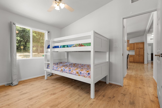 13955 Dusty Oaks Trl, Bella Vista, CA 96008 - bedroom featuring lofted ceiling, light wood-style floors, baseboards, and a ceiling fan
