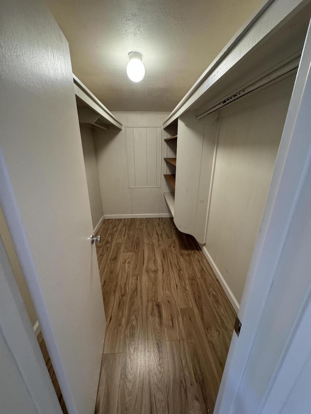 1717 Deer Creek Rd, Shasta Lake, CA 96019 - walk in closet with wood finished floors