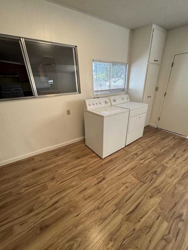 1717 Deer Creek Rd, Shasta Lake, CA 96019 - laundry area with independent washer and dryer and wood finished floors