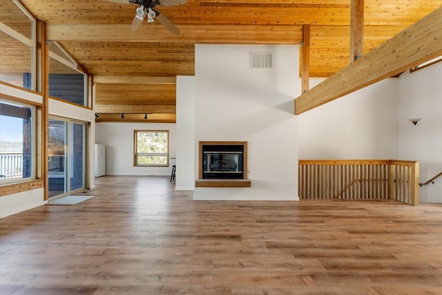 4740 Rainbow, Weed, CA 96094 - unfurnished living room with wooden ceiling, ceiling fan, wood finished floors, and a glass covered fireplace