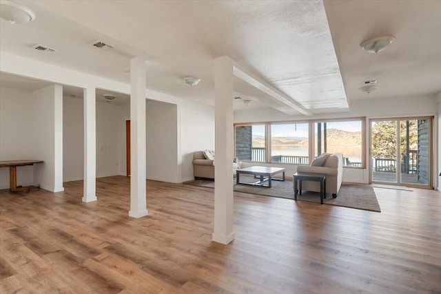 4740 Rainbow, Weed, CA 96094 - living room featuring healthy amount of natural light, light wood-style flooring, and a water view