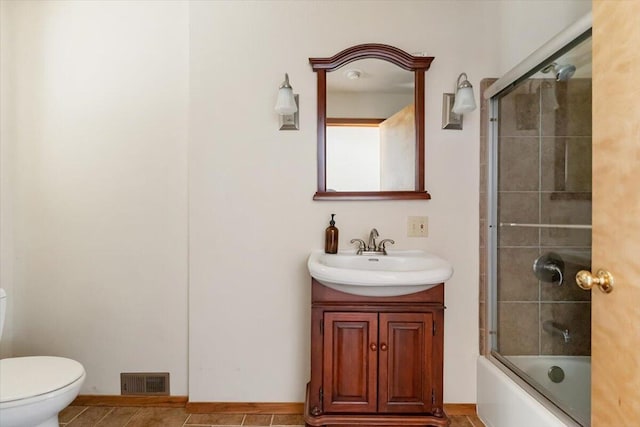 4740 Rainbow, Weed, CA 96094 - bathroom featuring toilet, vanity, combined bath / shower with glass door, and tile patterned floors