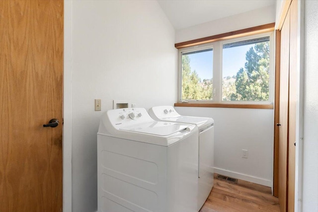 4740 Rainbow, Weed, CA 96094 - laundry room featuring separate washer and dryer, light wood-style flooring, and baseboards