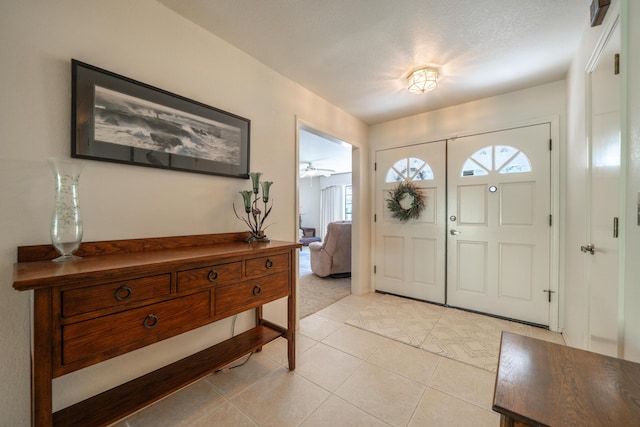 19991 Paso Robles Ave, Redding, CA 96003 - entrance foyer with plenty of natural light, light tile patterned floors, and light colored carpet