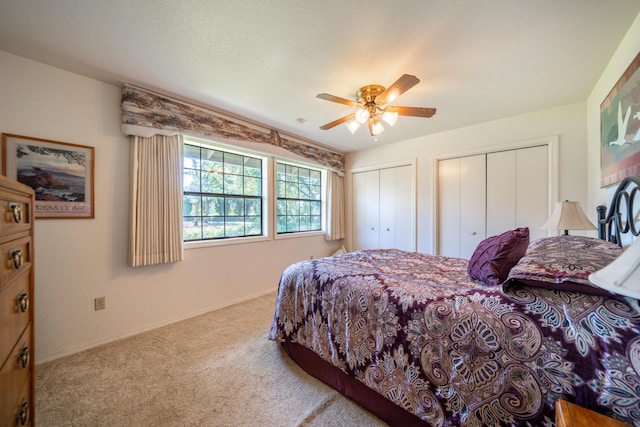 19991 Paso Robles Ave, Redding, CA 96003 - bedroom featuring multiple closets, carpet floors, a ceiling fan, and baseboards