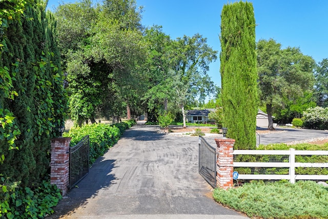 19991 Paso Robles Ave, Redding, CA 96003 - view of asphalt driveway featuring a gate