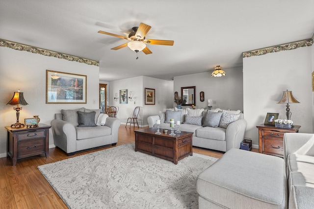 3608 Capricorn Way, Redding, CA 96002 - living area with ceiling fan, wood finished floors, and baseboards
