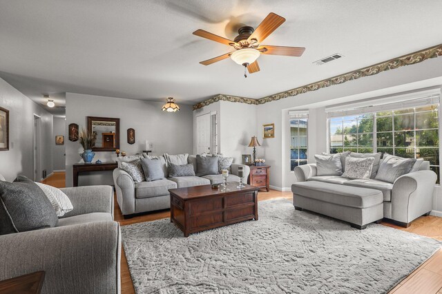 3608 Capricorn Way, Redding, CA 96002 - living area with wood finished floors and ceiling fan