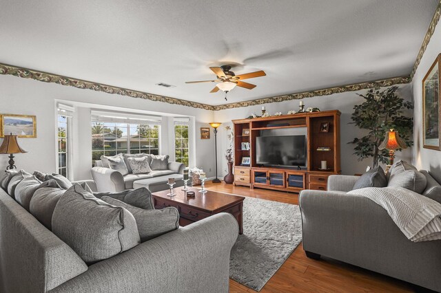3608 Capricorn Way, Redding, CA 96002 - living room featuring a ceiling fan and wood finished floors