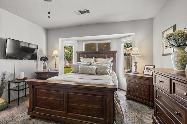 3608 Capricorn Way, Redding, CA 96002 - bedroom with multiple windows, dark carpet, and baseboards