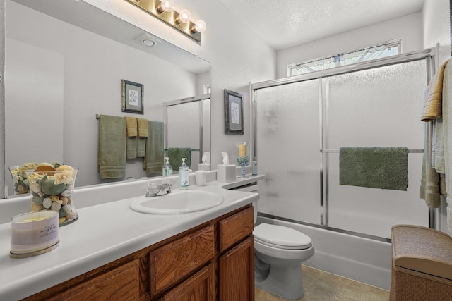 3608 Capricorn Way, Redding, CA 96002 - bathroom featuring vanity, toilet, and bath / shower combo with glass door
