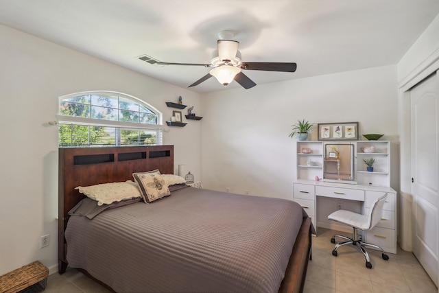 2654 Queens Way, Redding, CA 96001 - bedroom with light tile patterned flooring, a closet, and a ceiling fan