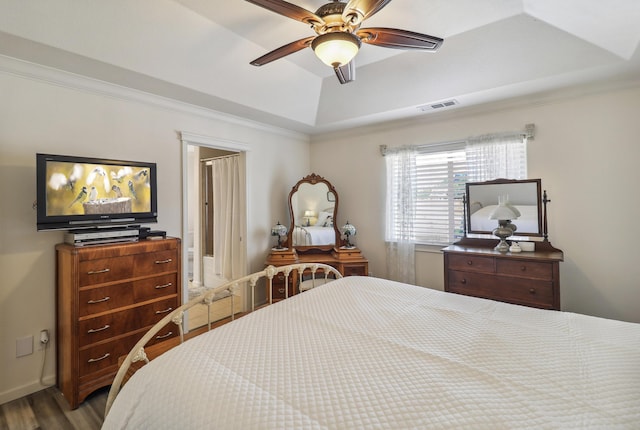 2654 Queens Way, Redding, CA 96001 - bedroom with a tray ceiling, wood finished floors, a ceiling fan, and crown molding