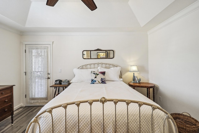 2654 Queens Way, Redding, CA 96001 - bedroom featuring dark wood-style flooring, a tray ceiling, a ceiling fan, baseboards, and crown molding