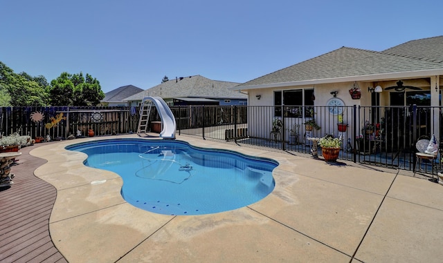 2654 Queens Way, Redding, CA 96001 - view of swimming pool with a water slide, a fenced backyard, and a patio