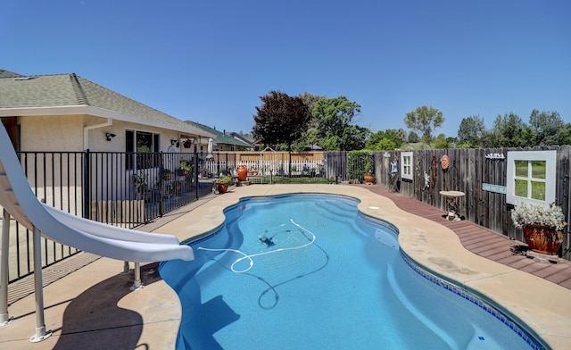 2654 Queens Way, Redding, CA 96001 - view of swimming pool with a water slide, a fenced backyard, and a patio area