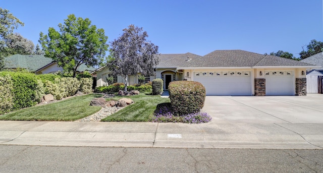 2654 Queens Way, Redding, CA 96001 - ranch-style home featuring an attached garage, concrete driveway, stucco siding, and a front yard