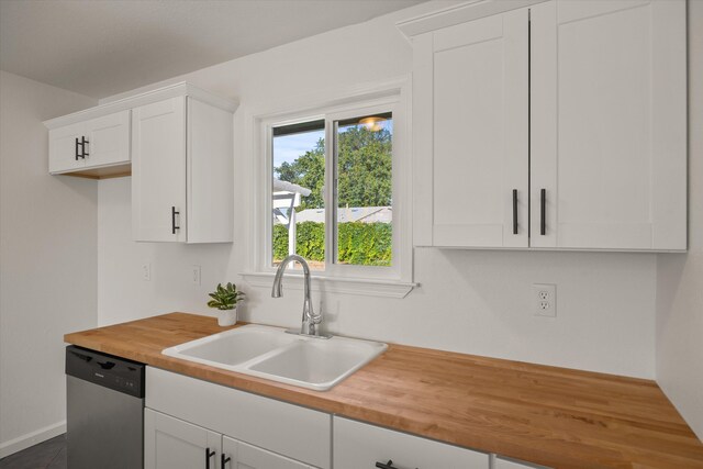 635 Nicklaus Ave, Red Bluff, CA 96080 - kitchen featuring dishwasher, wooden counters, a sink, white cabinets, and baseboards