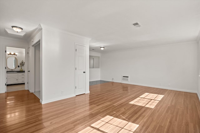 635 Nicklaus Ave, Red Bluff, CA 96080 - unfurnished room with crown molding, light wood-type flooring, baseboards, and a sink