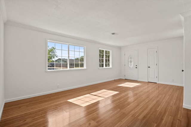 635 Nicklaus Ave, Red Bluff, CA 96080 - foyer entrance featuring crown molding, healthy amount of natural light, light wood-type flooring, and baseboards