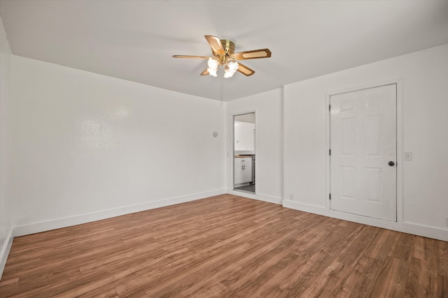 635 Nicklaus Ave, Red Bluff, CA 96080 - unfurnished bedroom with light wood finished floors, baseboards, ceiling fan, and ensuite bathroom
