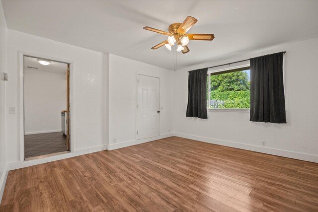 635 Nicklaus Ave, Red Bluff, CA 96080 - unfurnished bedroom with wood finished floors, baseboards, and ceiling fan