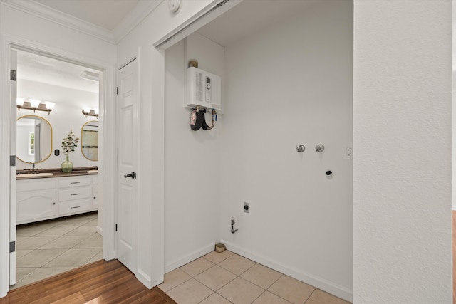 635 Nicklaus Ave, Red Bluff, CA 96080 - laundry area featuring hookup for an electric dryer, ornamental molding, water heater, light tile patterned floors, and hookup for a gas dryer
