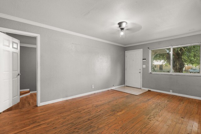 3262 Camellia St, Anderson, CA 96007 - spare room featuring hardwood / wood-style flooring, a ceiling fan, ornamental molding, and baseboards