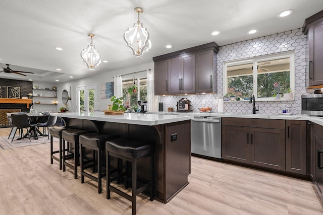 4223 Alta Mesa Dr, Redding, CA 96002 - kitchen with appliances with stainless steel finishes, a chandelier, light countertops, tasteful backsplash, and recessed lighting