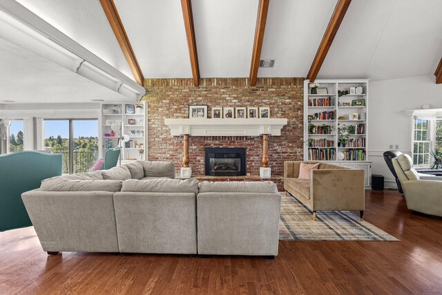 3330 Scenic Dr, Redding, CA 96001 - living area with a brick fireplace, wood finished floors, and built in shelves