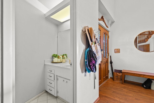 3330 Scenic Dr, Redding, CA 96001 - bathroom with vanity, wood finished floors, and baseboards