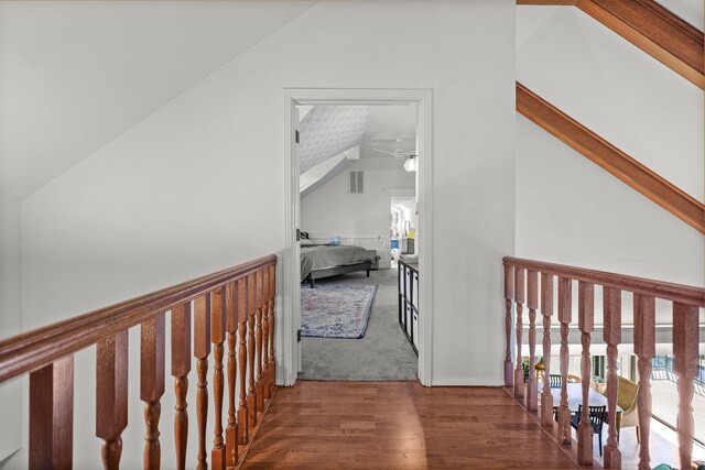 3330 Scenic Dr, Redding, CA 96001 - hallway with lofted ceiling, wood finished floors, and wainscoting