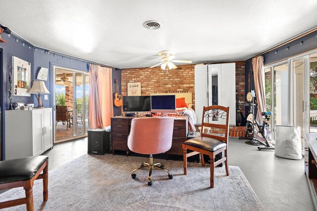 3330 Scenic Dr, Redding, CA 96001 - office area featuring a ceiling fan, brick wall, and concrete floors