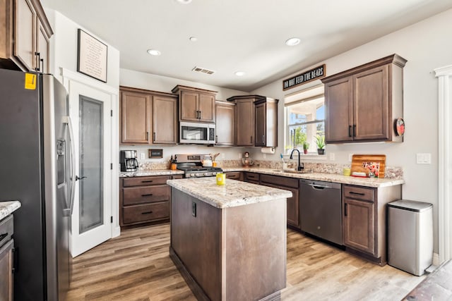 3126 Chaucer Way, Shasta Lake, CA 96019 - kitchen with stainless steel appliances, a sink, light wood-style floors, light stone countertops, and recessed lighting