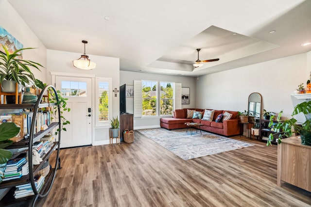 3126 Chaucer Way, Shasta Lake, CA 96019 - living room with wood finished floors, a tray ceiling, ceiling fan, and baseboards