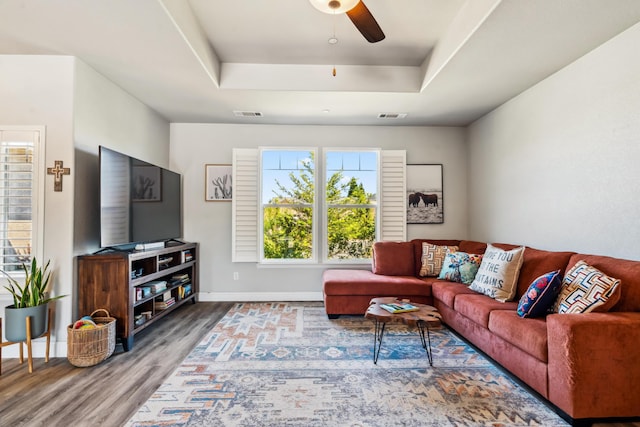 3126 Chaucer Way, Shasta Lake, CA 96019 - living room featuring wood finished floors, a raised ceiling, a ceiling fan, and baseboards