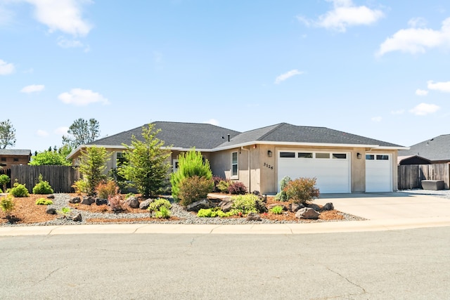 3126 Chaucer Way, Shasta Lake, CA 96019 - ranch-style home featuring an attached garage, driveway, stucco siding, and roof with shingles