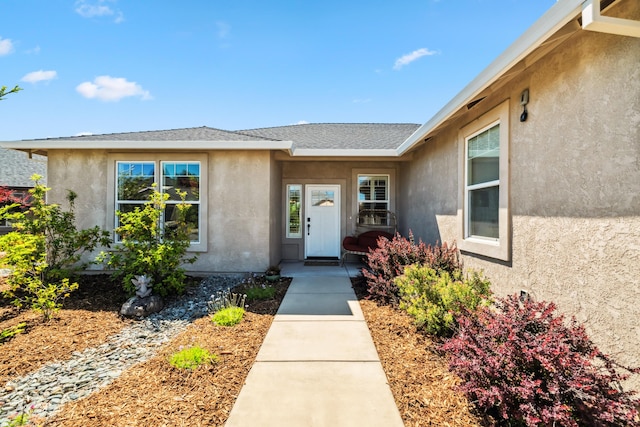 3126 Chaucer Way, Shasta Lake, CA 96019 - entrance to property featuring stucco siding and a shingled roof