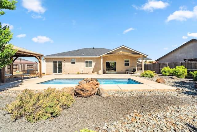 3126 Chaucer Way, Shasta Lake, CA 96019 - back of house featuring a gazebo, stucco siding, a patio, and a fenced backyard