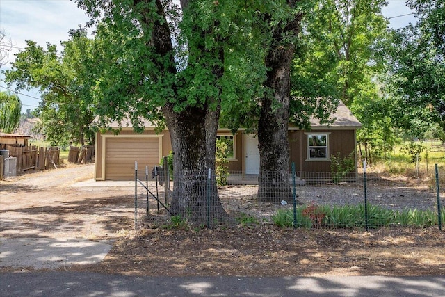 5890 Missouri Ln, Anderson, CA 96007 - obstructed view of property featuring dirt driveway and a garage