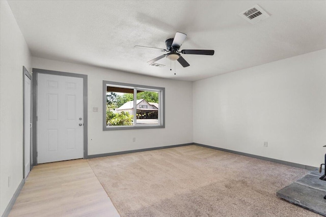 5890 Missouri Ln, Anderson, CA 96007 - entryway featuring a ceiling fan, baseboards, light wood-style floors, and light carpet